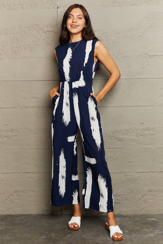 Printed Round Neck Cutout Jumpsuit with Pockets The Stout Steer